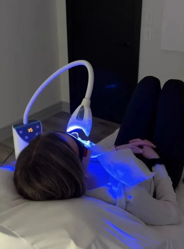 Client during an in-spa teeth whitening session
