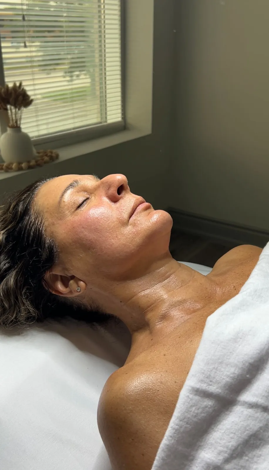 Client relaxing with a chemical peel applied